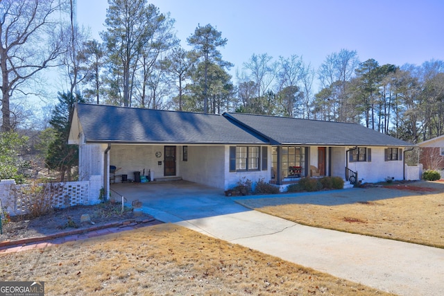 ranch-style house featuring a carport