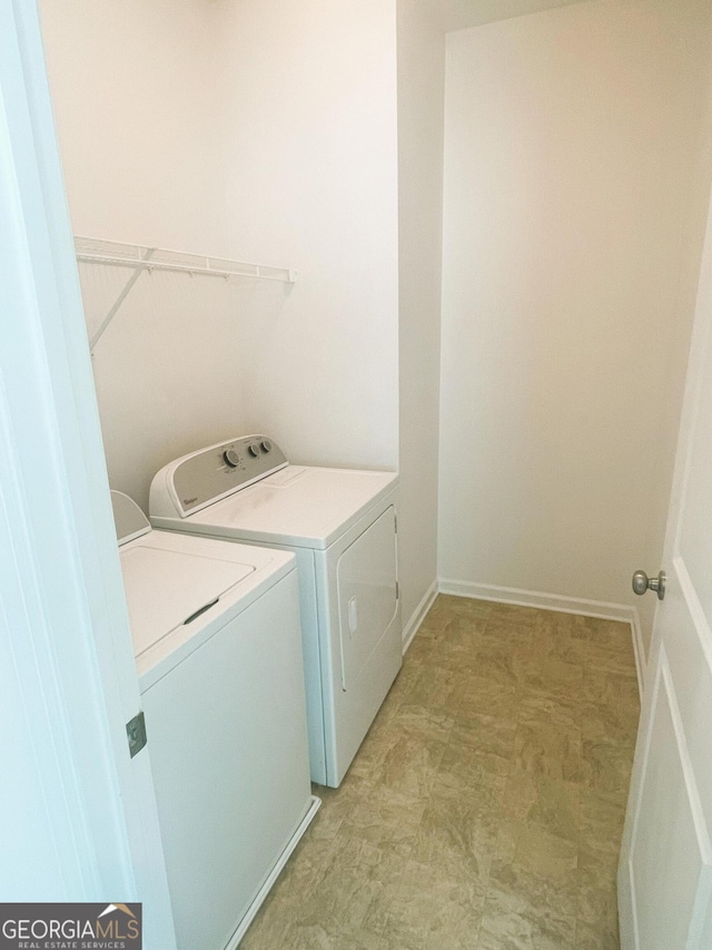 laundry area with independent washer and dryer