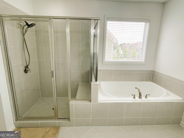 bathroom with plus walk in shower and tile patterned floors