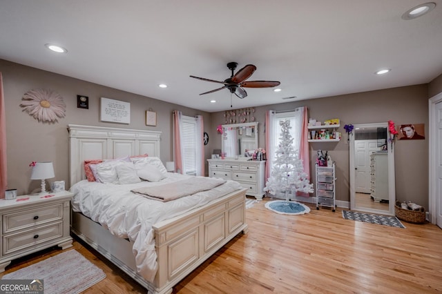 bedroom featuring ceiling fan and light hardwood / wood-style floors