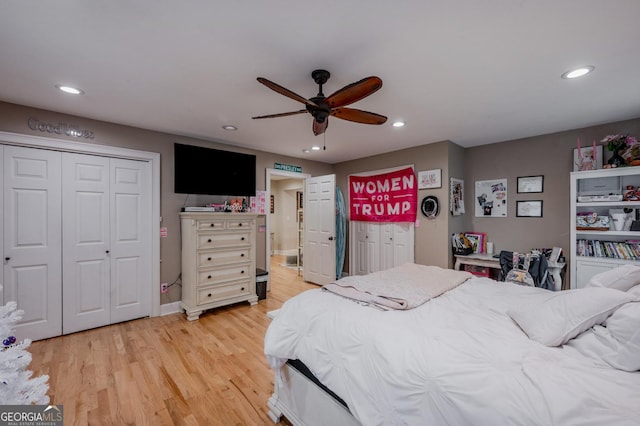 bedroom with ceiling fan and hardwood / wood-style floors