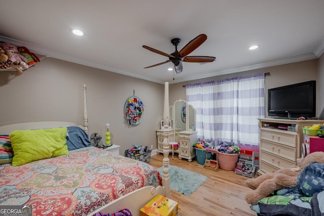 bedroom featuring ceiling fan, wood-type flooring, and crown molding