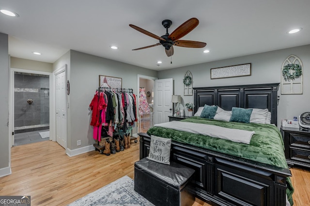 bedroom with ceiling fan, light hardwood / wood-style floors, and connected bathroom