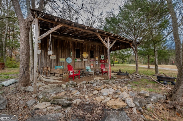 view of patio featuring an outbuilding