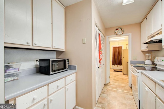 kitchen with white cabinetry and white electric stove