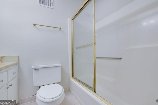 full bathroom with shower / bath combination with glass door, vanity, toilet, and tile patterned flooring