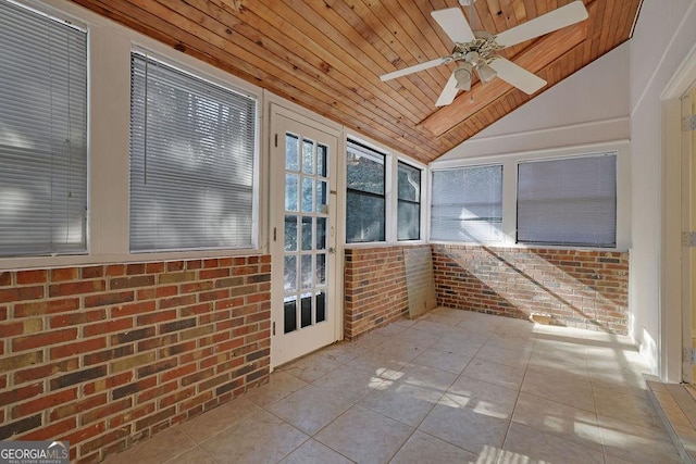 unfurnished sunroom featuring lofted ceiling, wooden ceiling, and ceiling fan