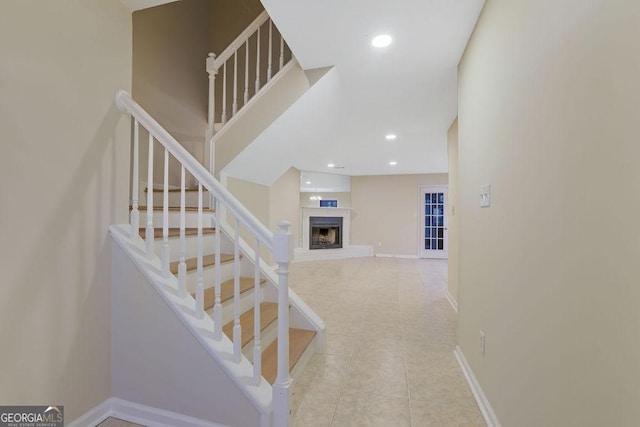 stairs with tile patterned flooring