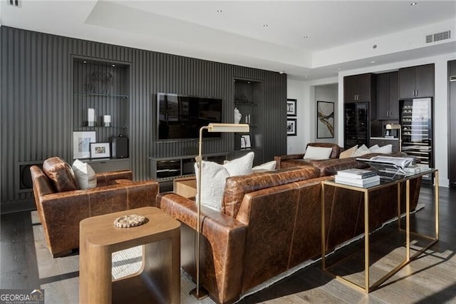 living room featuring a tray ceiling