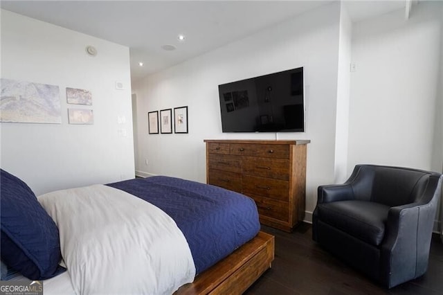 bedroom featuring dark hardwood / wood-style flooring