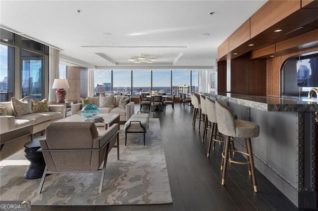 interior space with a wall of windows and dark hardwood / wood-style flooring