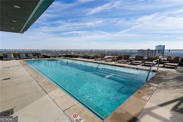 view of pool featuring a patio area