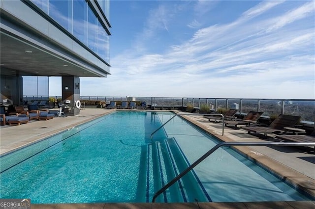 view of swimming pool featuring a patio area