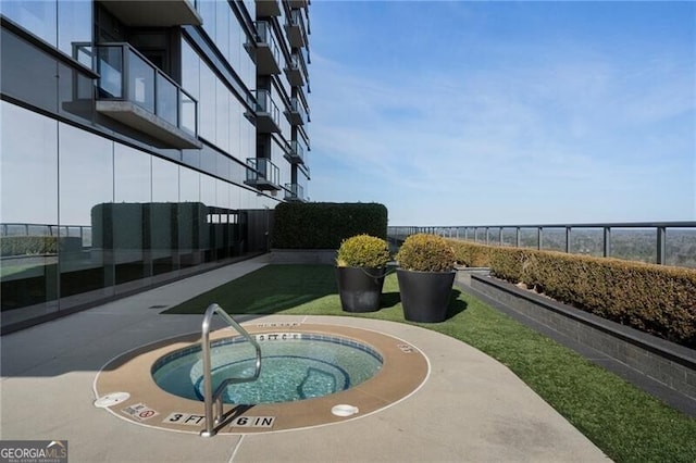 view of pool with a community hot tub