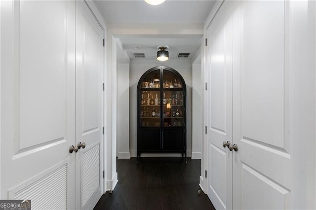 hall with dark wood-type flooring