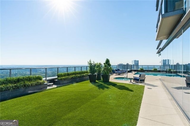 view of yard with a pool with hot tub and a patio area