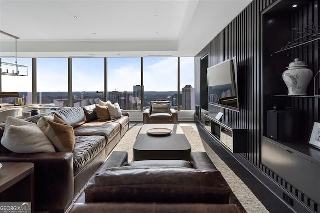 living room with an inviting chandelier and a healthy amount of sunlight