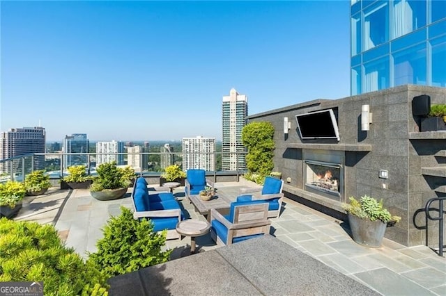 view of patio featuring exterior fireplace