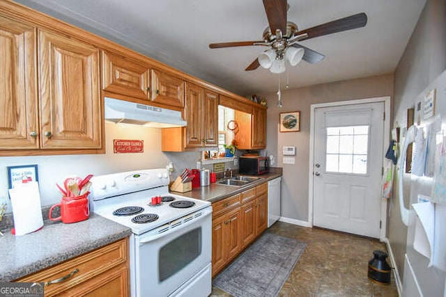 kitchen featuring under cabinet range hood, white appliances, a sink, and brown cabinetry