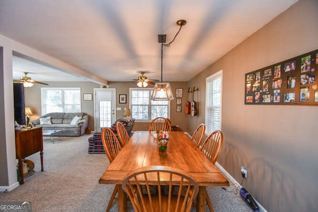 dining room with ceiling fan, carpet flooring, and baseboards