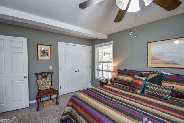 bedroom featuring a ceiling fan, a closet, and light carpet