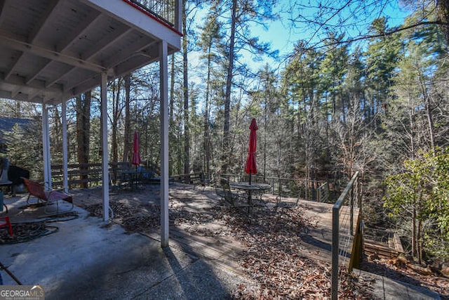 view of yard featuring a patio area and a balcony