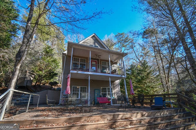 back of property featuring a balcony