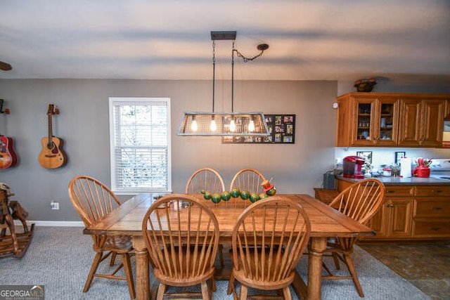 dining room with baseboards