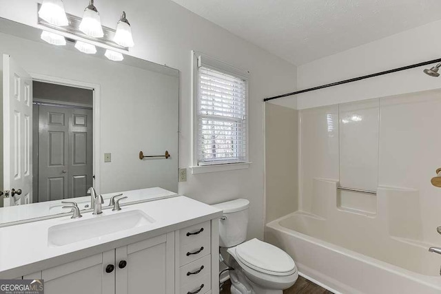 full bathroom with toilet, shower / bathtub combination, and vanity