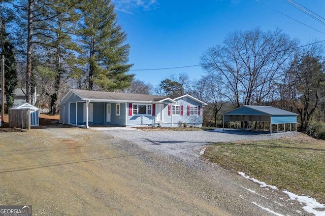 ranch-style home featuring a front lawn and a carport