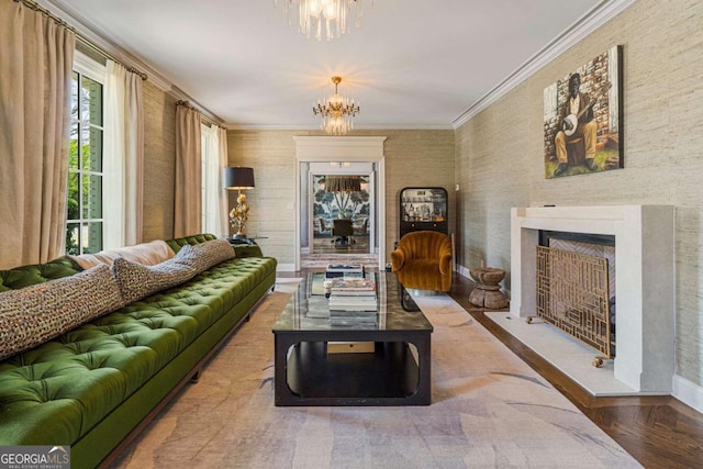 living room featuring an inviting chandelier, ornamental molding, and parquet flooring