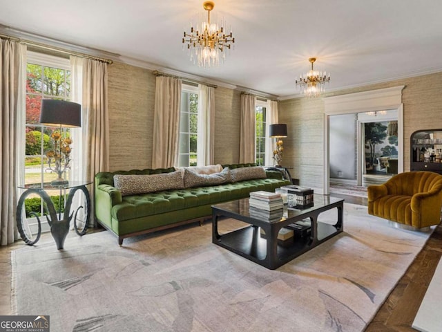 living room featuring ornamental molding and a notable chandelier