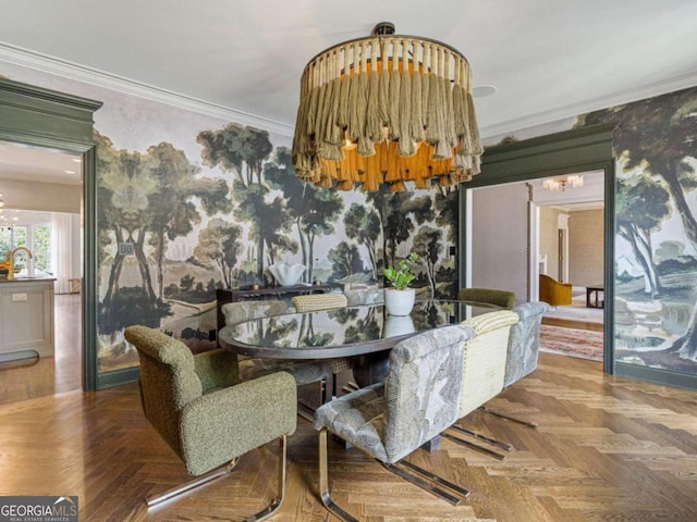 dining area with crown molding, parquet flooring, and a notable chandelier