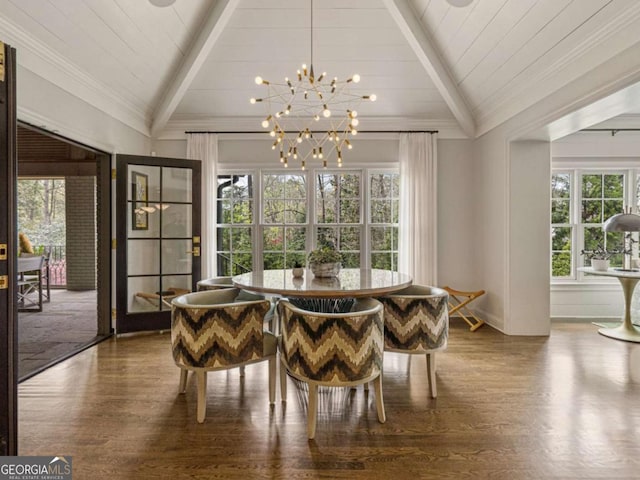 dining area with vaulted ceiling with beams, crown molding, wood finished floors, and a notable chandelier