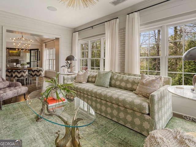 3612 Castlegate Dr NW, Atlanta, GA 30327 - living room featuring ornamental molding and a chandelier