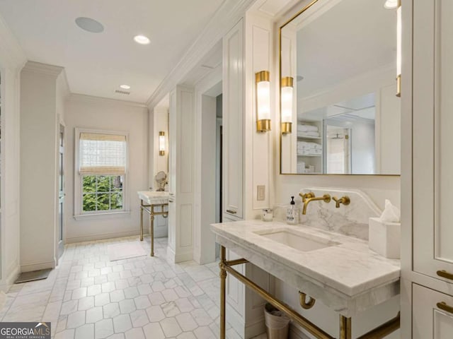 bathroom featuring visible vents, ornamental molding, tile patterned flooring, a sink, and recessed lighting