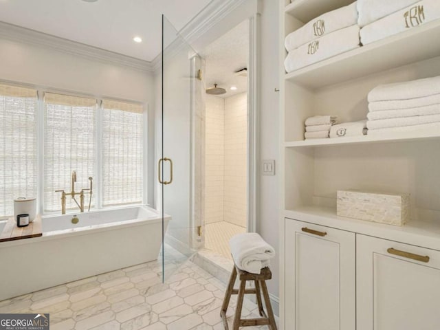 full bath with a shower stall, ornamental molding, a freestanding bath, and recessed lighting