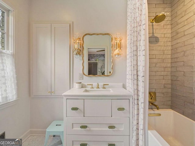 full bath featuring shower / bathtub combination with curtain, baseboards, and vanity