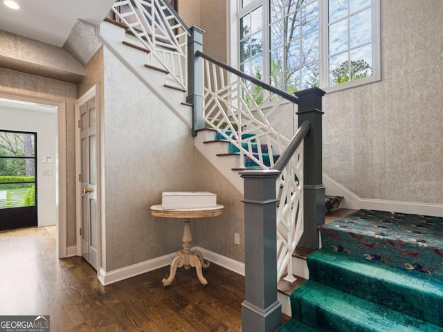 3612 Castlegate Dr NW, Atlanta, GA 30327 - stairway featuring baseboards, wood finished floors, and a healthy amount of sunlight