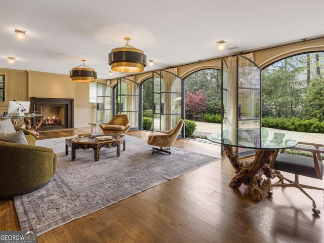 3612 Castlegate Dr NW, Atlanta, GA 30327 - interior space with a lit fireplace and wood finished floors