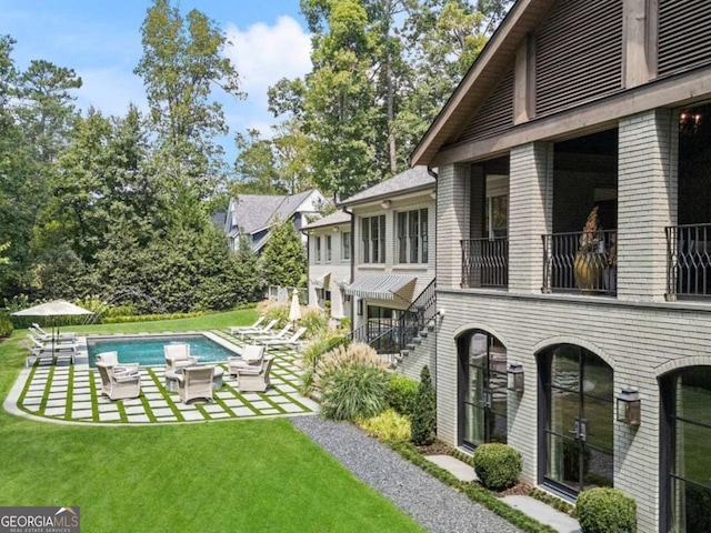 exterior space with a lawn and a patio area