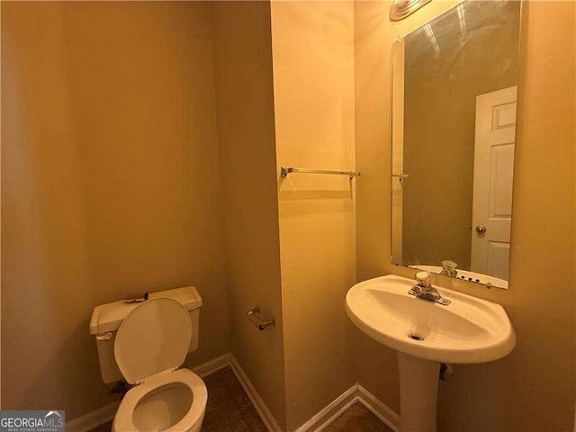 bathroom featuring toilet