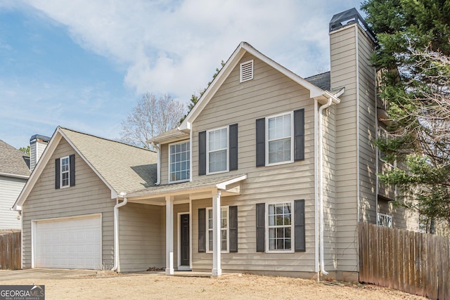 view of front of property with a garage