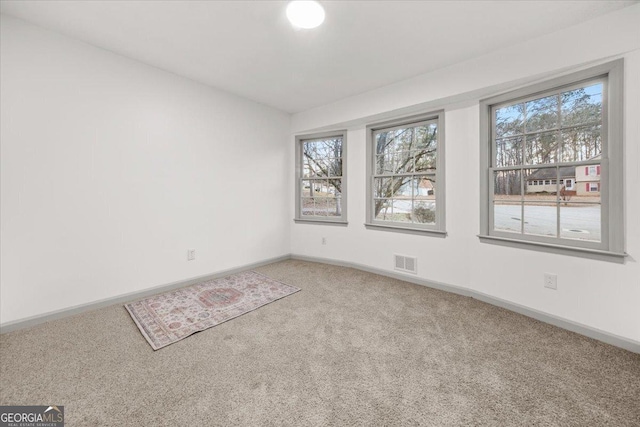 view of carpeted spare room