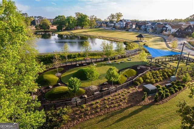 birds eye view of property with a water view