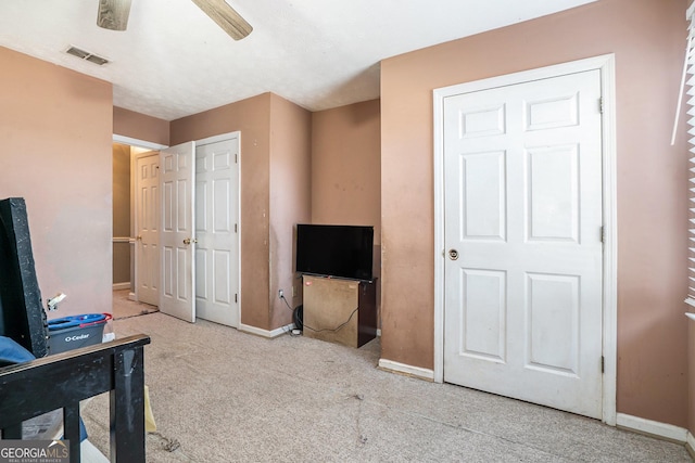 bedroom with ceiling fan and light colored carpet