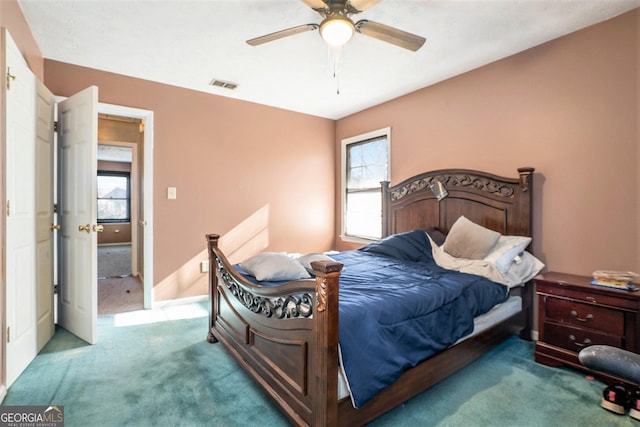 carpeted bedroom with ceiling fan