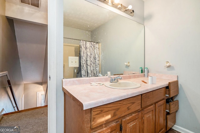 bathroom featuring vanity and a shower with curtain