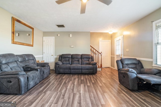 living room with hardwood / wood-style flooring and ceiling fan