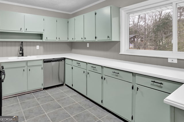 kitchen with sink, stainless steel dishwasher, and ornamental molding